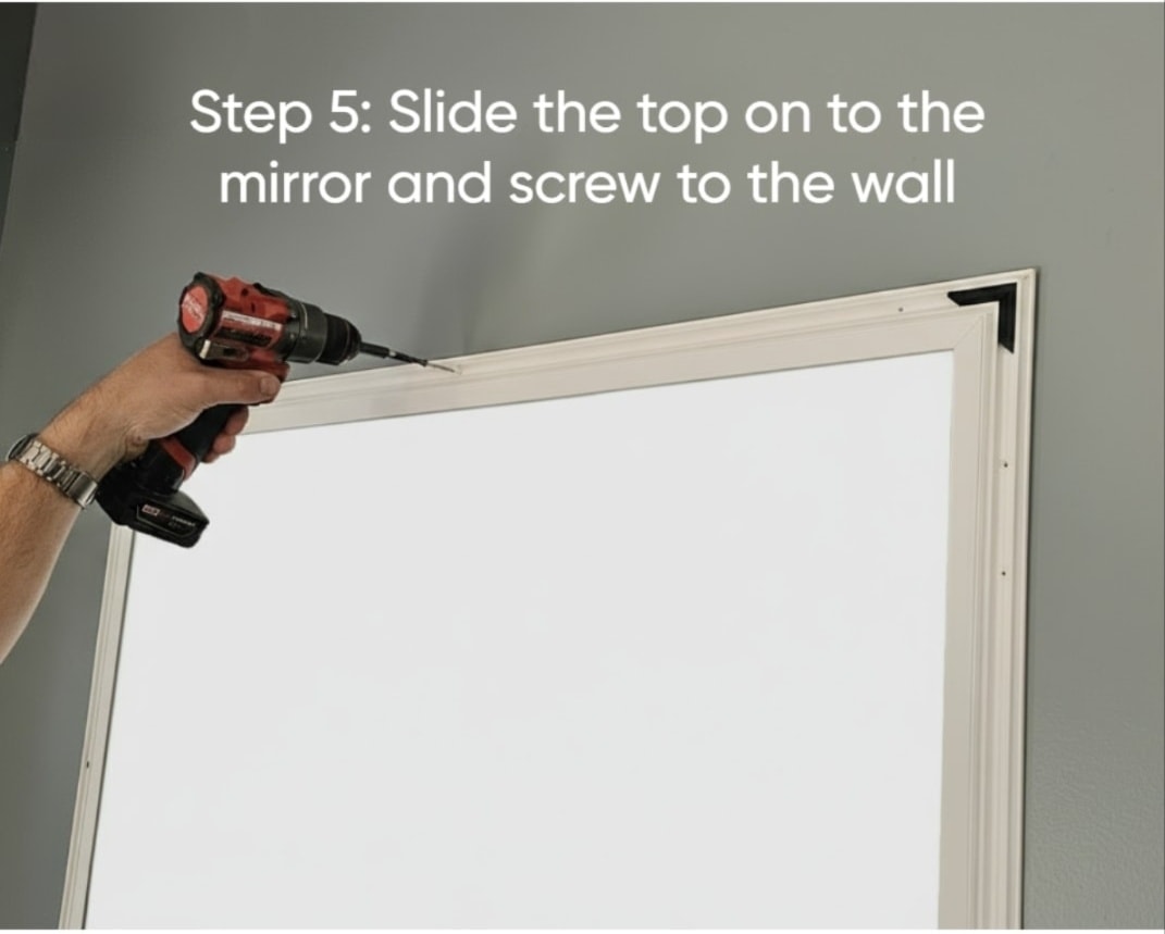 Installing the top frame channel onto the mirror
